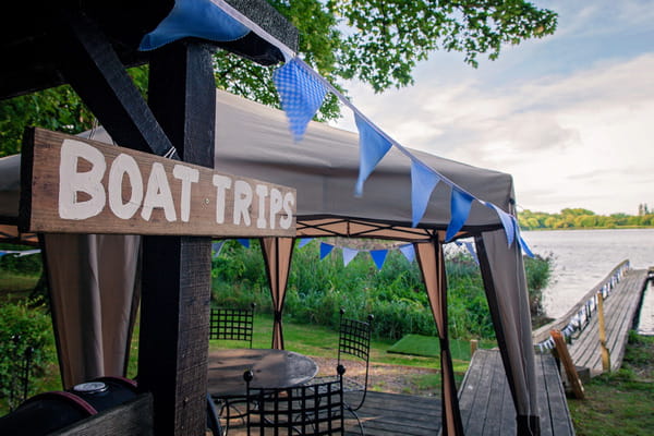 Boat trips sign by lake