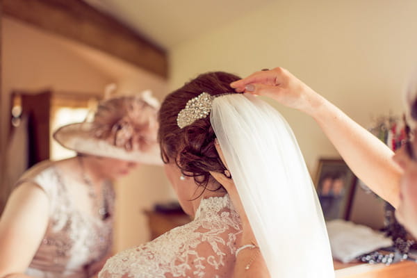 Putting on bride's veil
