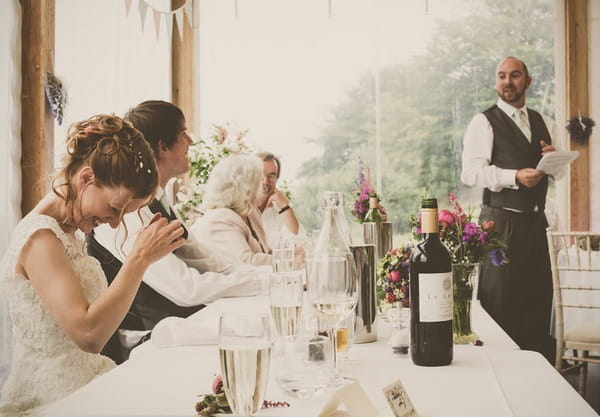 Bride laughing at best man speech - Picture by Tracey Warbey Photography