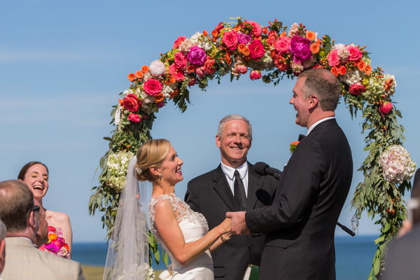 Bride and groom laughing during wedding ceremony on Nantucket Island