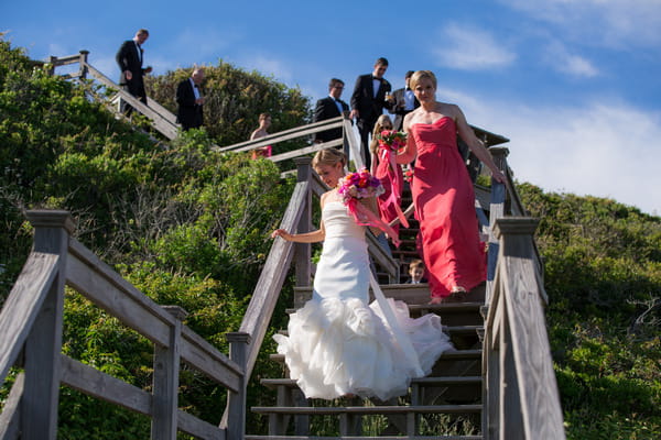 Bridal party walking down steps to beach on Nantucket Island