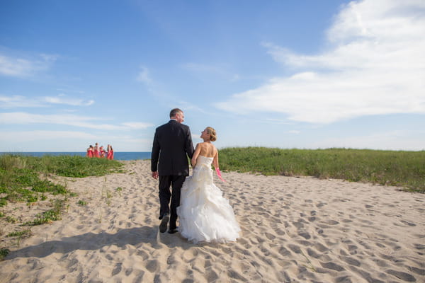 Bride and groom walking on Nantucket Island beach