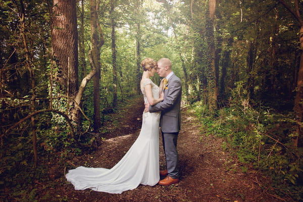 Bride and groom in woods