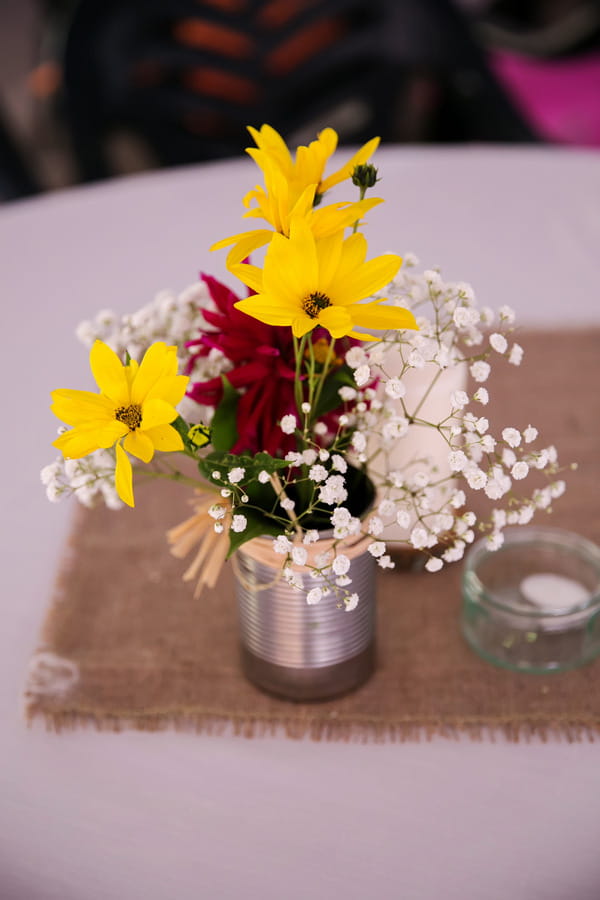 Colourful wedding flowers in can