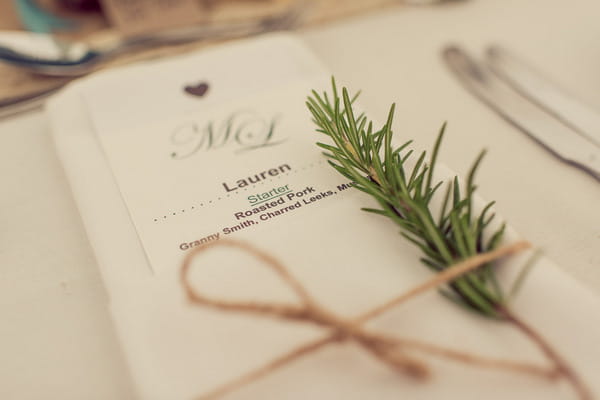 Wedding place setting with rosemary