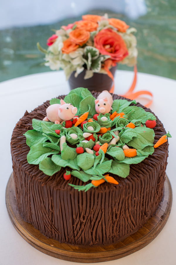 Cake with sugar pigs and vegetable patch