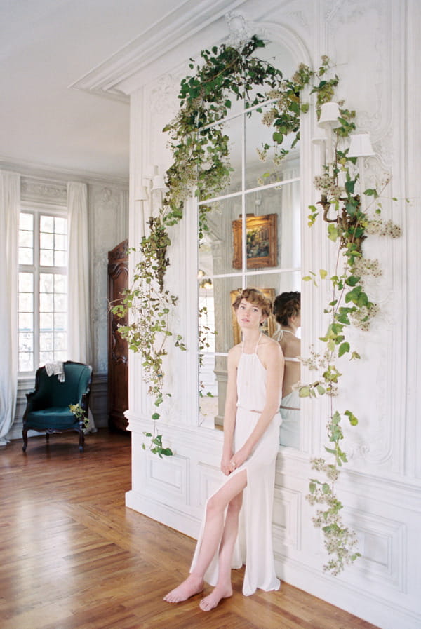 Bride leaning against window effect mirror