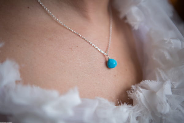 Blue stone on bride's necklace