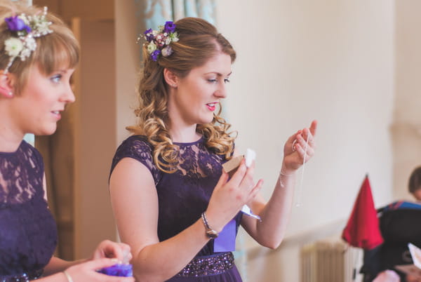 Bridesmaid looking at gift