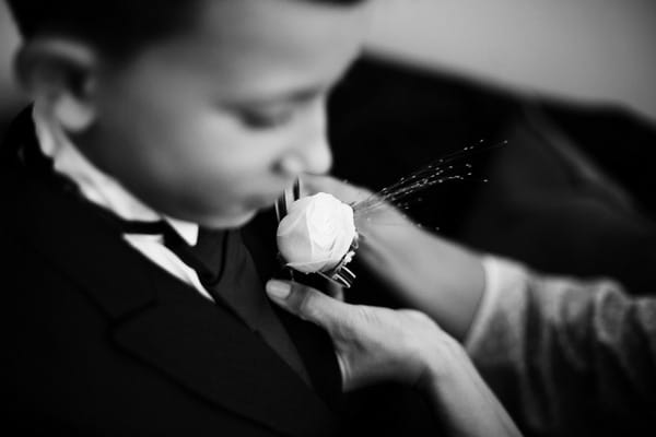 Helping boy with buttonhole