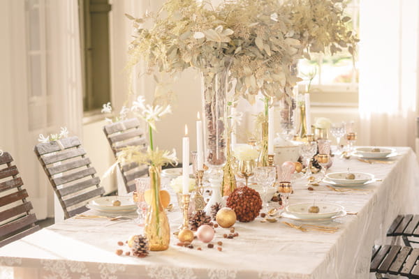 Elegant wedding table with tall flower centrepieces