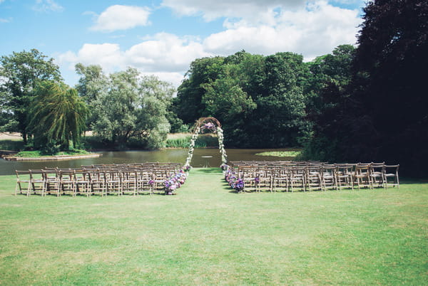 Wedding seating by lake at Narborough Hall Gardens