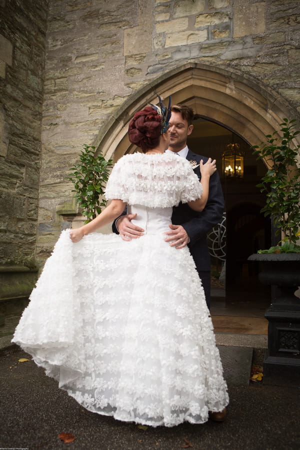 Bride and groom outside The Great Hall at The Alverton Hotel