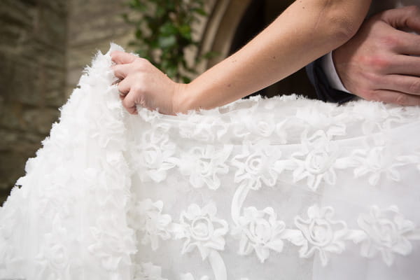 Detail on bride's winter wedding dress