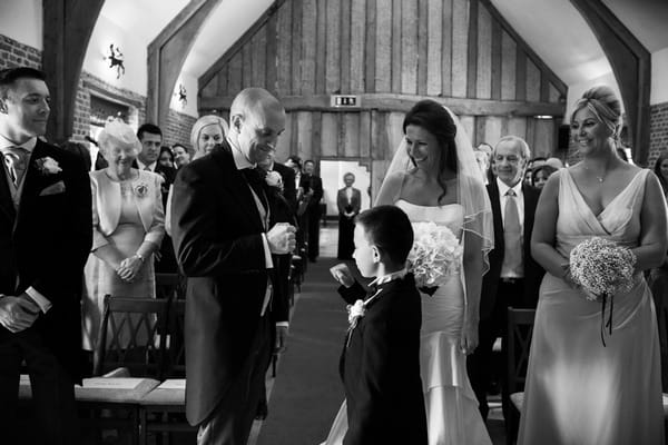 Groom and pageboy doing special handshake