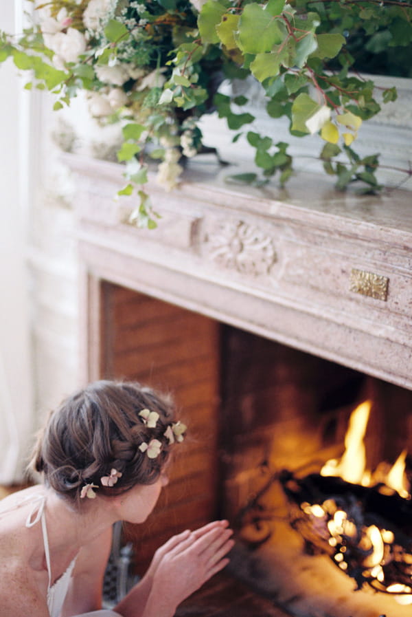 Bride warming hands on fire