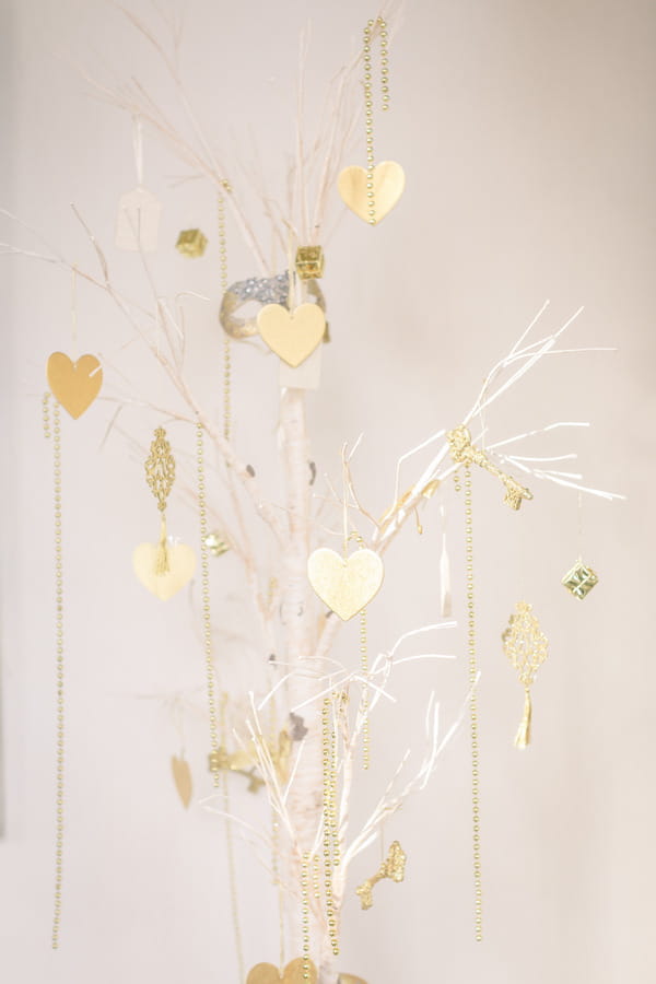 Gold hearts hanging from tree