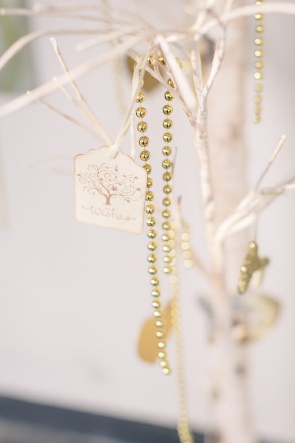 Wishes tag and gold beads on tree