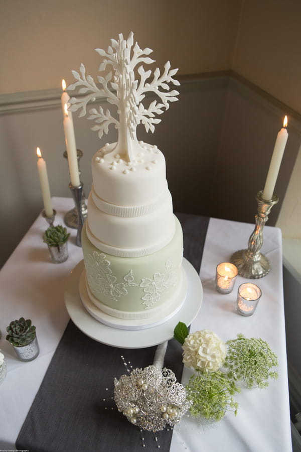 Elegant wedding cake with tree topper