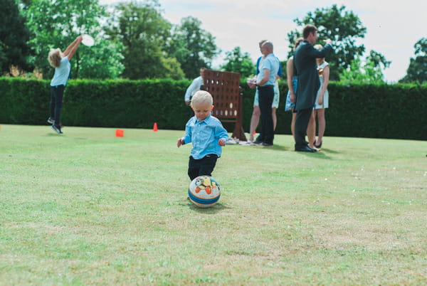 Young boy playing with ball at Narborough Hall Gardens