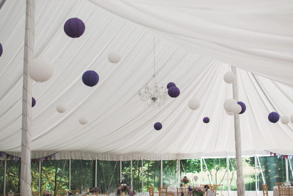 Purple and white lanterns hanging from marquee