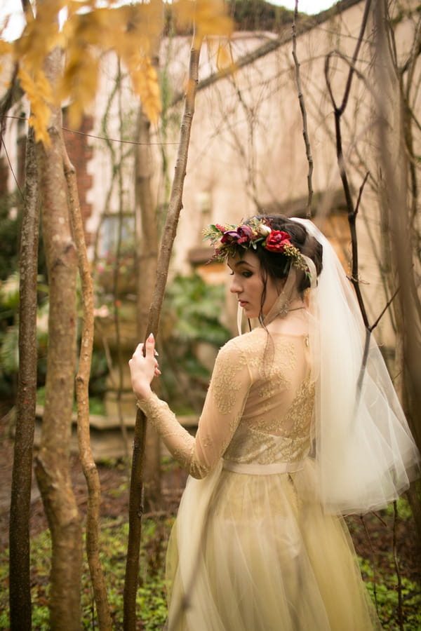 Bride walking through trees