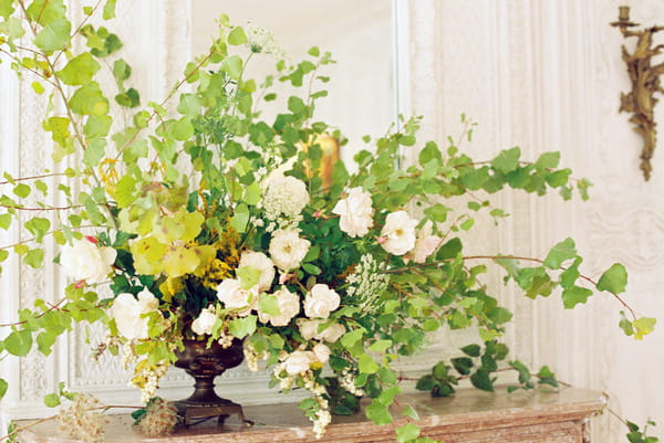 Large floral and foliage display on fireplace