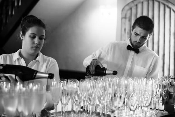 Pouring champagne for wedding speeches