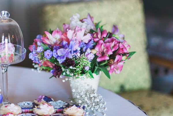 Purple and pink flowers on table