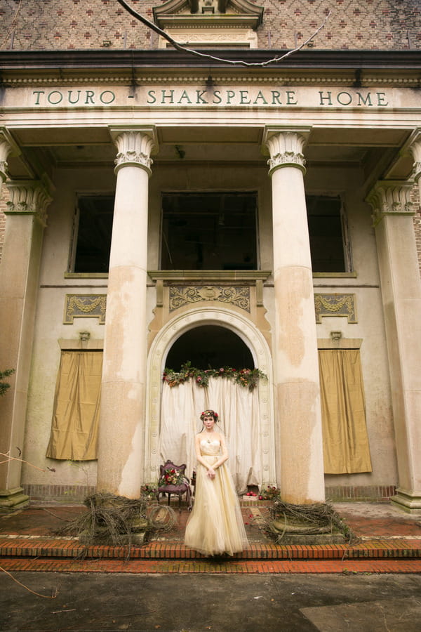 Bride standing in front of pillars