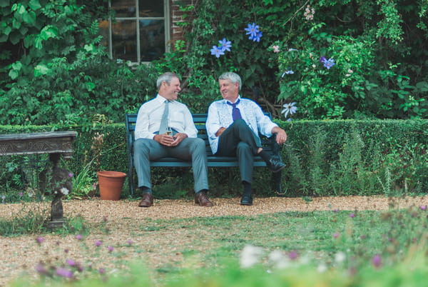 Wedding guests relaxing at Narborough Hall Gardens