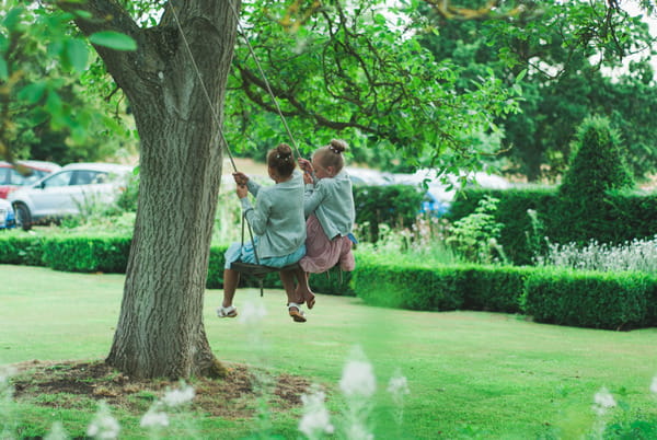 Children on rope swing at Narborough Hall Gardens