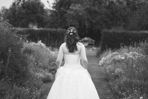 Bride walking around Narborough Hall Gardens