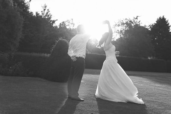 Bride twirling at Narborough Hall Gardens