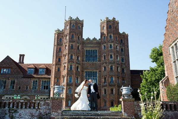 Bride and groom outside Layer Marney Tower
