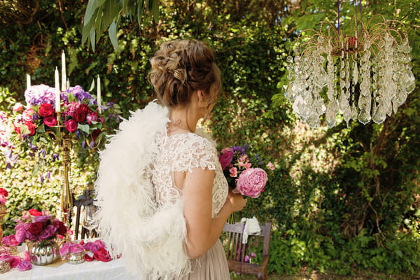 Bride with lace detail wedding dress and white shrug