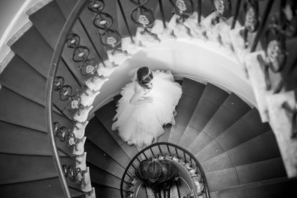 Bride walking up staircase at Belair House