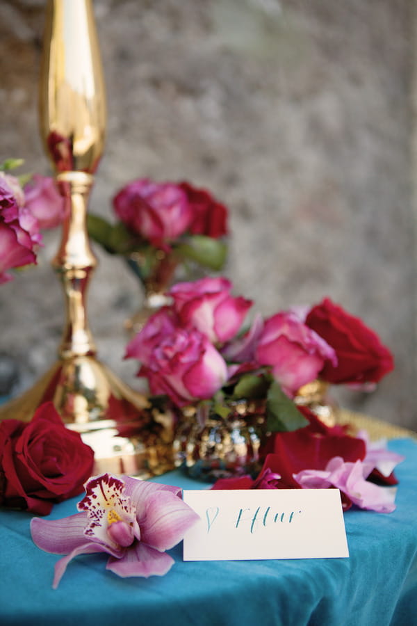 Roses and name card on small table