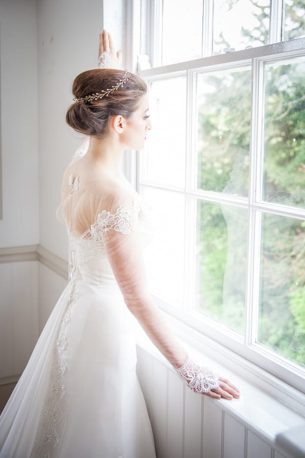 Bride looking out of window at Belair House