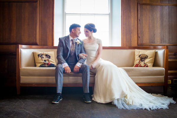 Bride and groom sitting on couch at Belair House