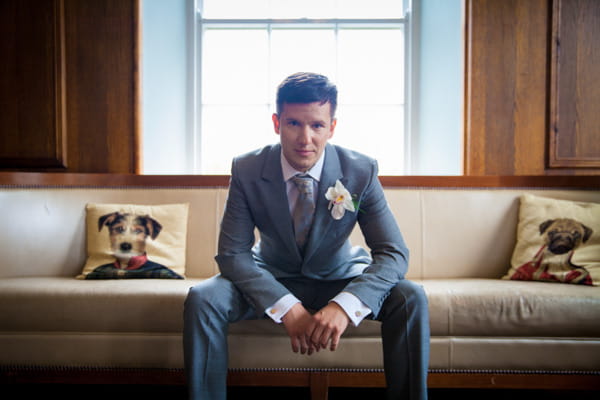 Groom sitting on couch