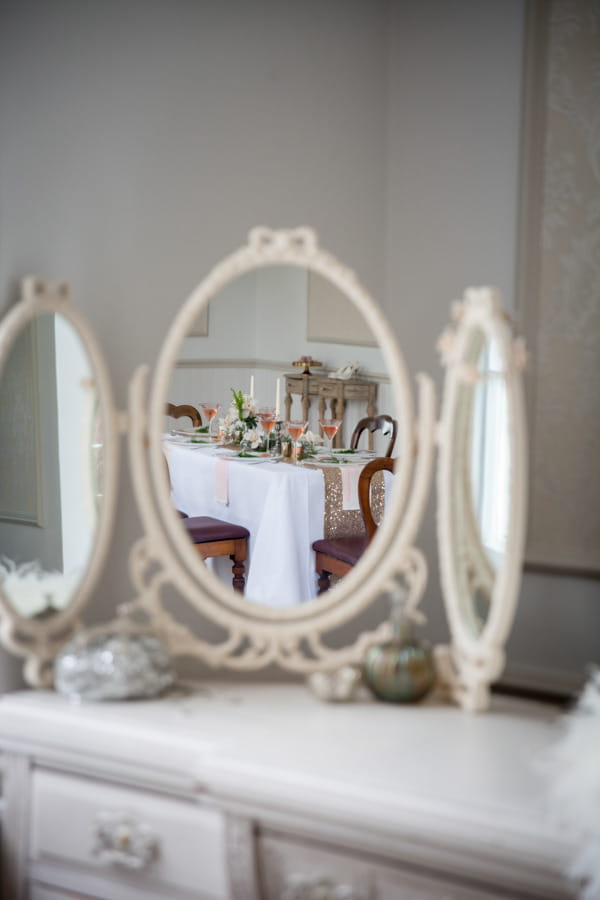 Reflection of wedding table in mirror