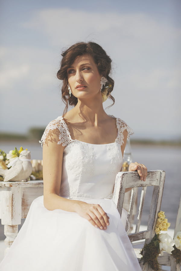 Bride wearing wedding dress with lace detail