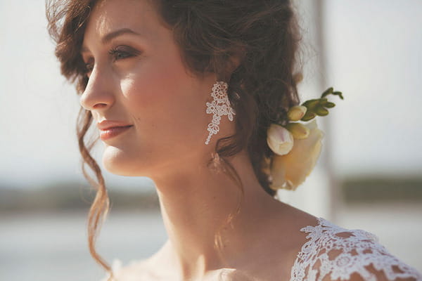 Bride's updo hairstyle and earrings