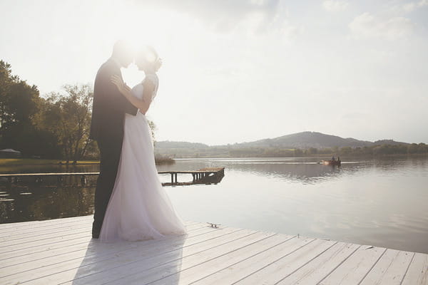 Bride and groom by Lake of Candia in Italy