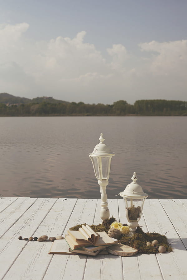 Vintage style lamps by lake in Italy