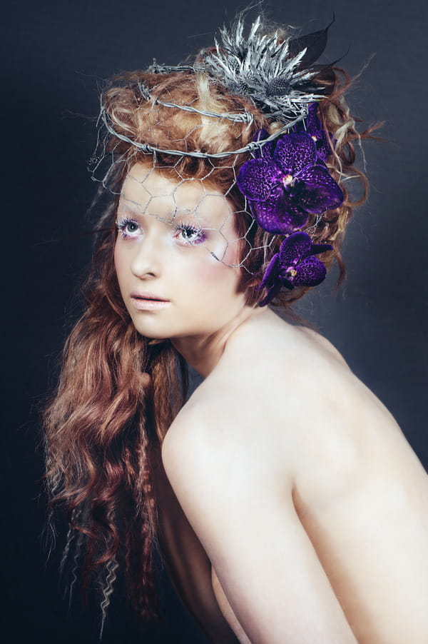 Alternative bride with purple orchids in hair