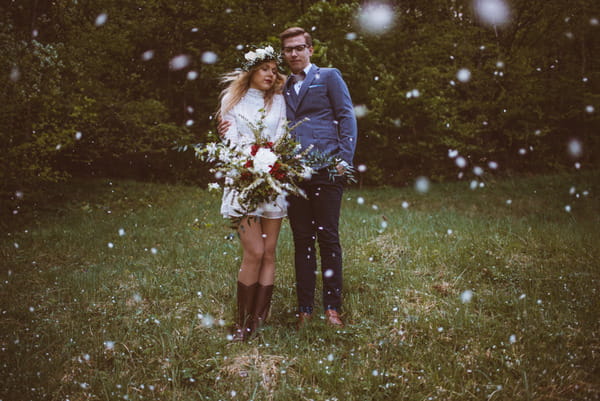 Vintage bride and groom standing on grass