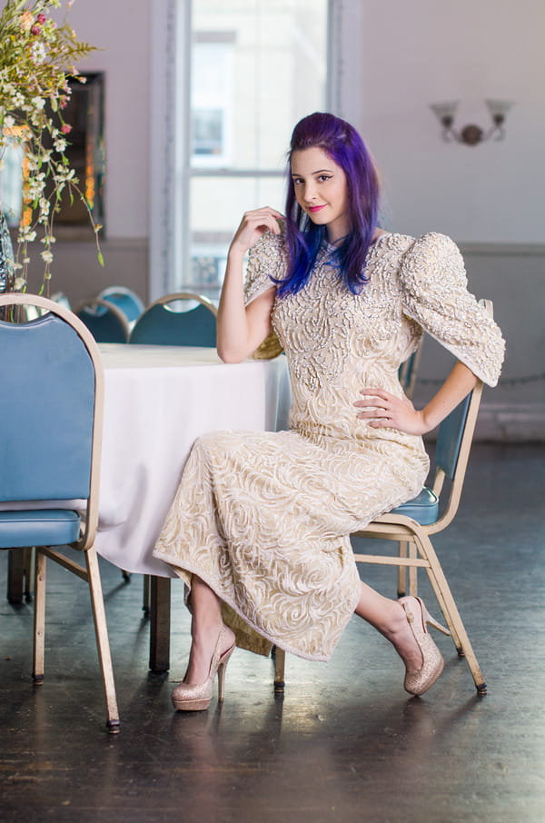 Bride wearing vintage wedding dress with beading detail