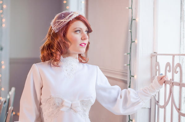 Vintage bride looking out of the window